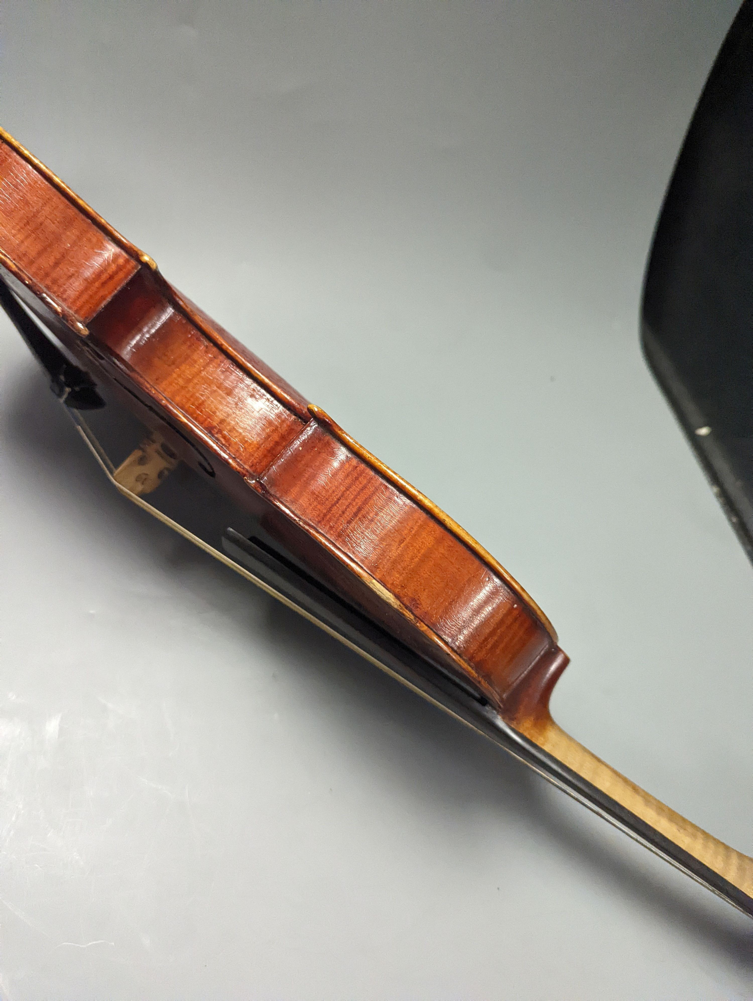 A violin in a mahogany case, case makers, Withers and sons, case 79 cms high.